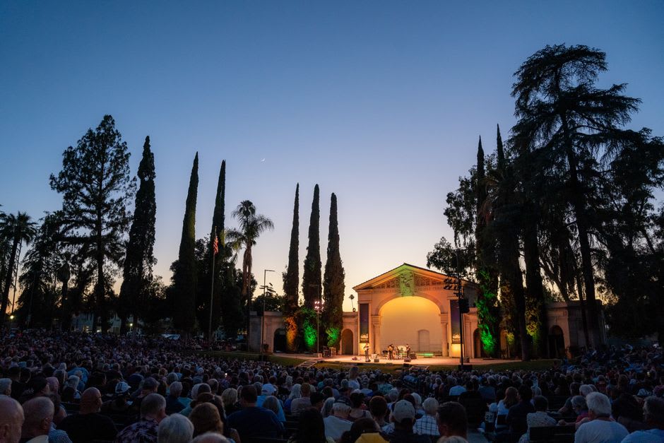 Crowds gathered at an open-air concert in the Murphy Arts District music garden in El Dorado, Arkansas