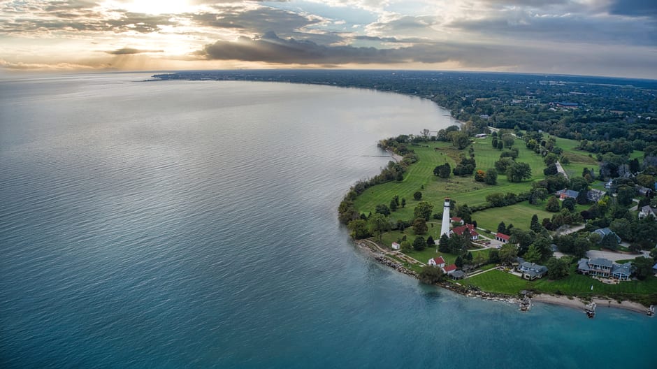 The white Lakeside Park lighthouse framed by gardens on the shore of Lake Winnebago in Fond du Lac, Wisconsin