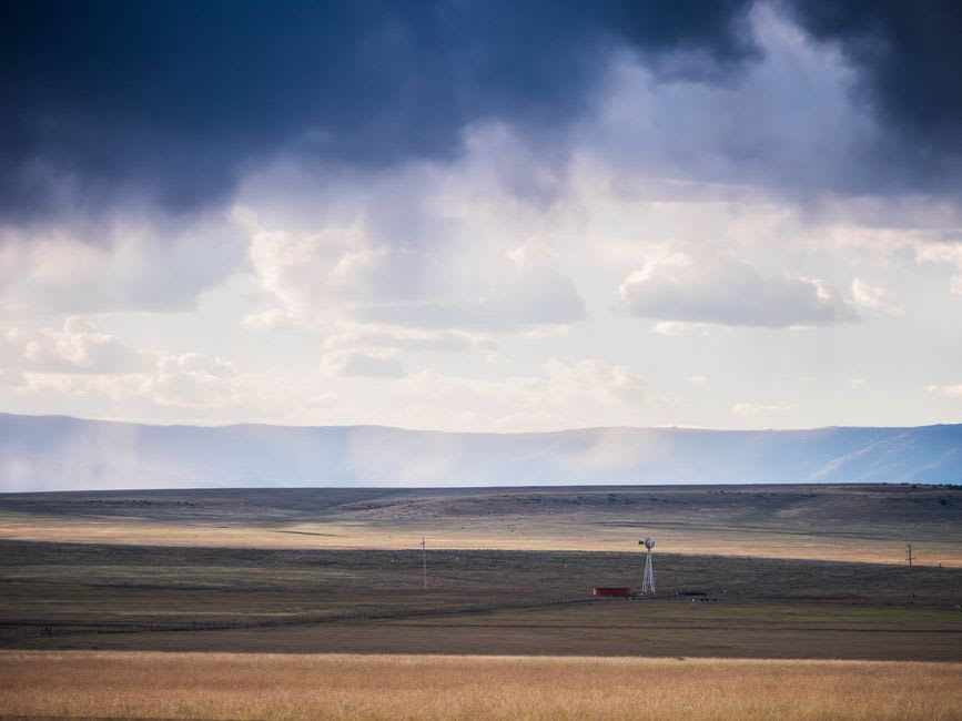 Storm clouds building over the Sierra Nevada above ranchland near Gardnerville, Nevada