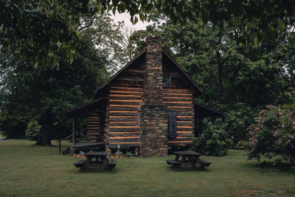 A weathered log cabin among the trees along the Roaring Fork trail near Gatlinburg