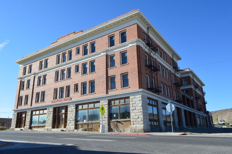 The ornate brick facade of the historic Goldfield Hotel in Goldfield, Nevada