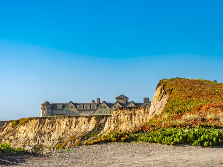 A farm stand piled with pumpkins near Half Moon Bay