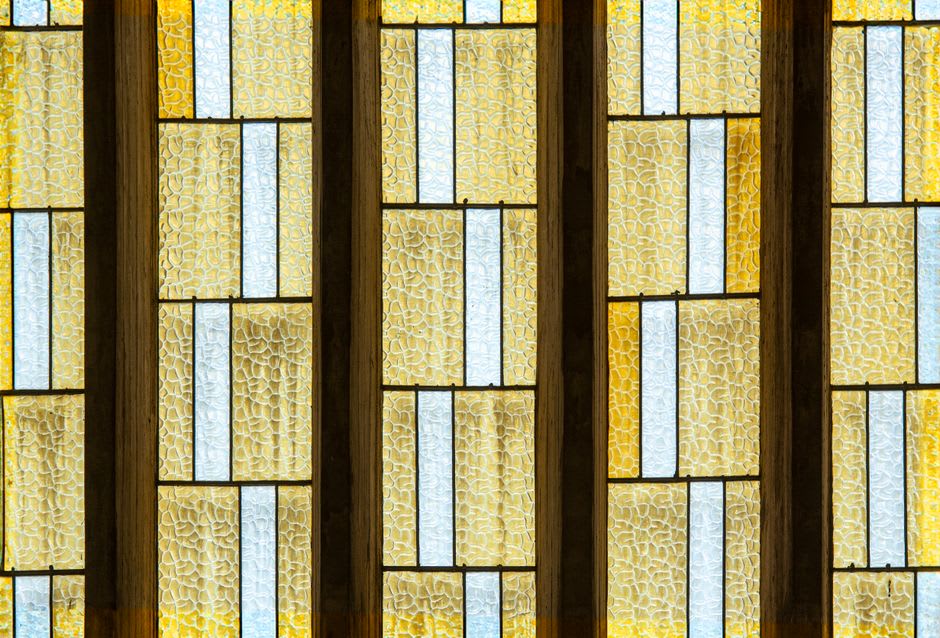 The horizontal Prairie School lines and art glass windows of the Frank Lloyd Wright-designed Bradley House in Kankakee, Illinois