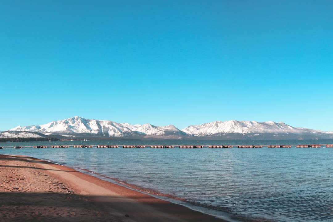 Rounded granite boulders in the crystal-clear shallows of Sand Harbor on Lake Tahoe's Nevada shore