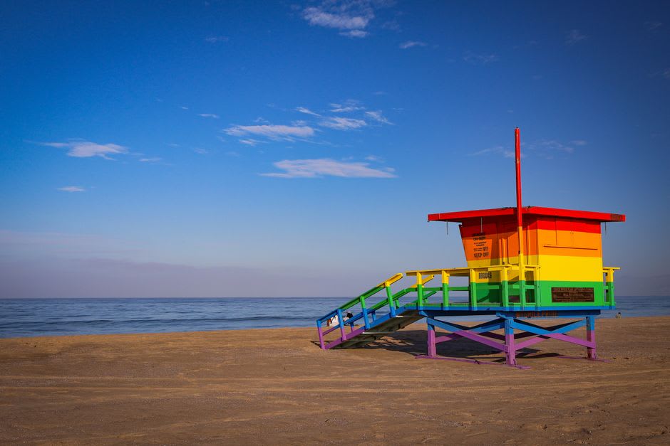 The Santa Monica Pier and Ferris wheel at sunset with the Pacific Ocean behind