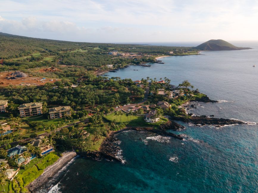 The rust-colored sand and turquoise water of Kaihalulu red sand beach near Hana