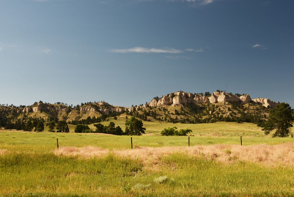 The Milky Way arching over the dark buttes above Medora at night