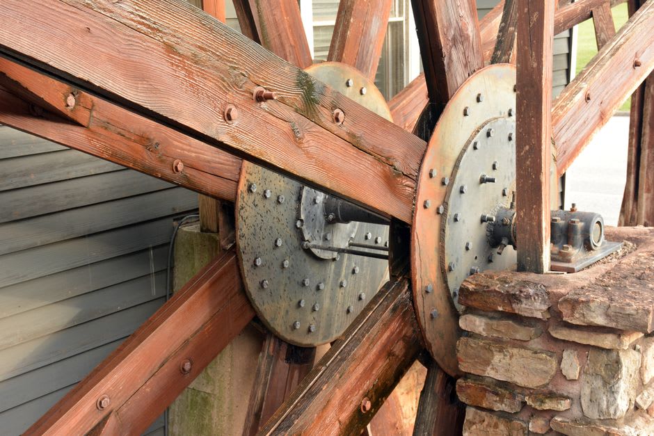 The working waterwheel and stone walls of the historic grist mill in Metamora, Indiana