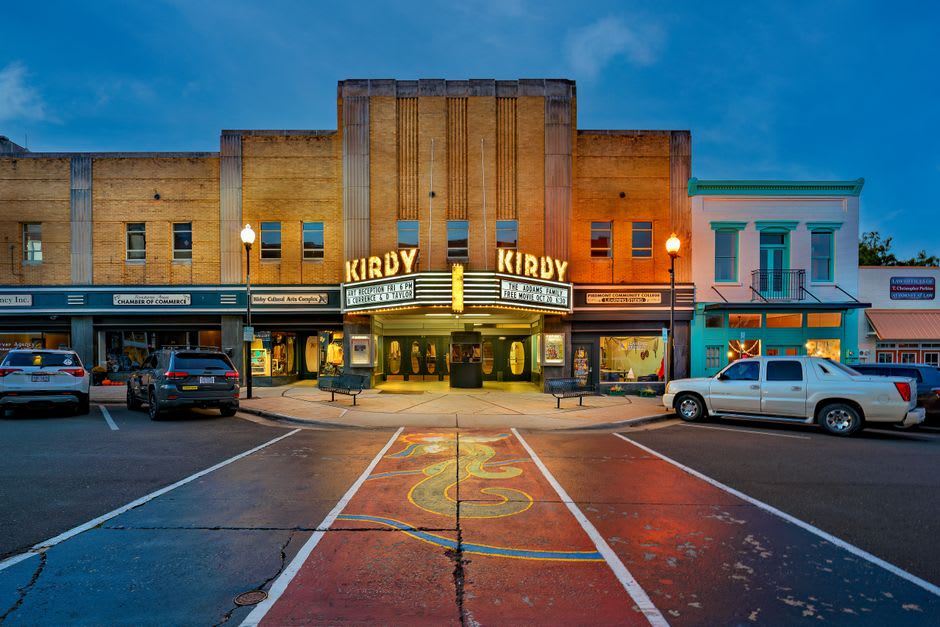 A restored Art Deco theater marquee lit up on Franklin Street in Michigan City, Indiana
