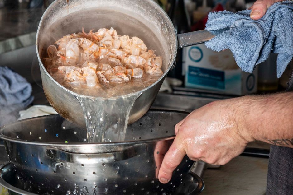 A pile of freshly boiled Louisiana shrimp served at a dockside stand in Morgan City
