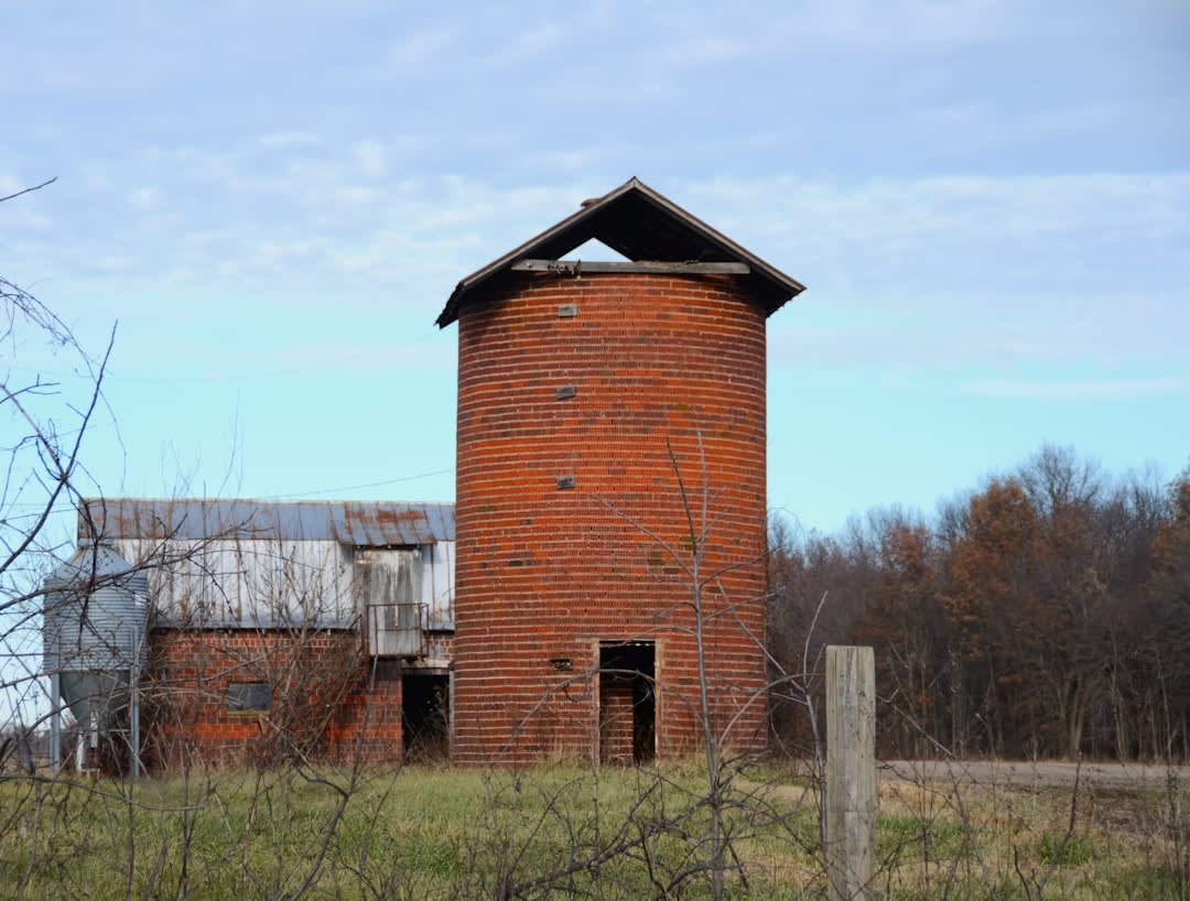 A restored round barn and farmhouse at the historic Amish farmstead outside Nappanee, Indiana