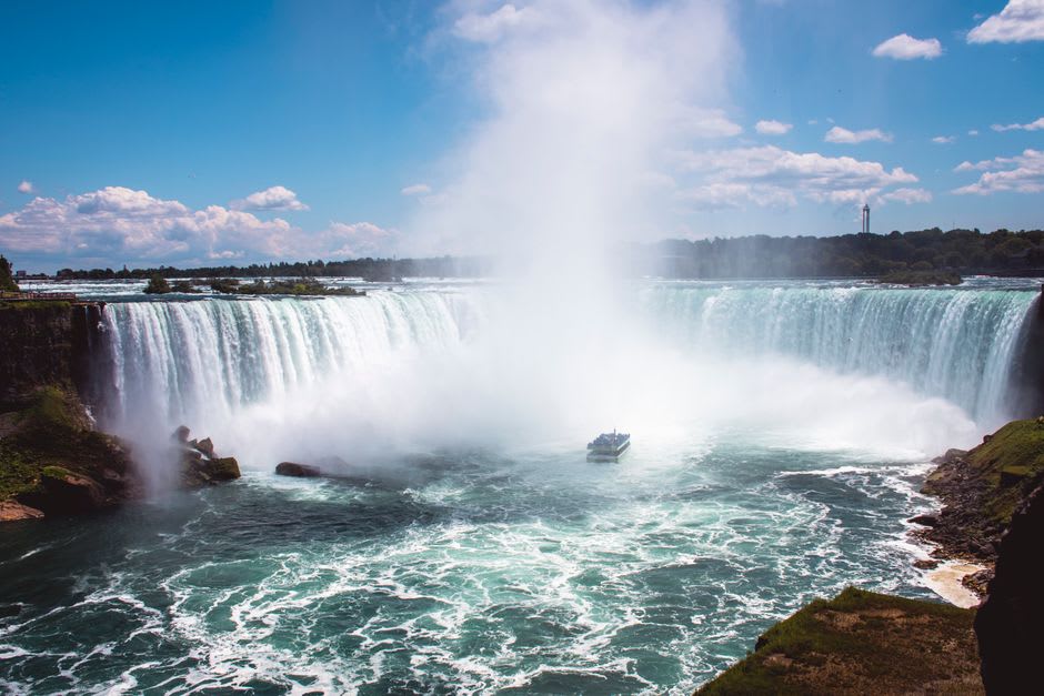 The Maid of the Mist boat approaching the base of the Horseshoe Falls through heavy spray