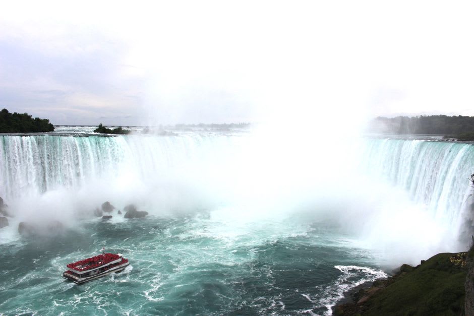 The full sweep of the Horseshoe Falls illuminated in colored lights after dark