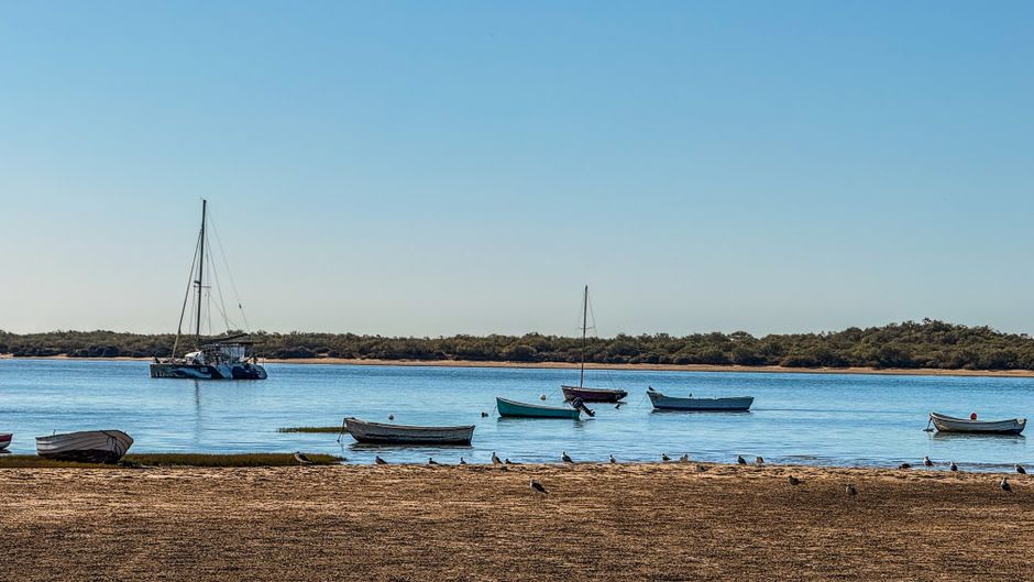 Sailboats anchored off a wide sandy beach at Lake McConaughy near Ogallala, Nebraska