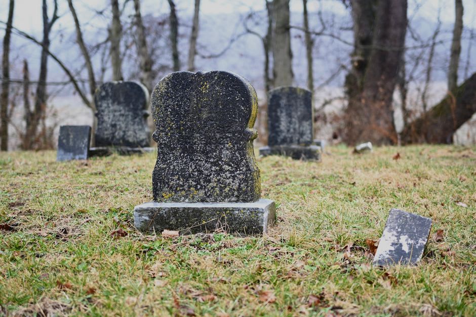 Weathered headstones on the hillside at Boot Hill Cemetery in Ogallala, Nebraska