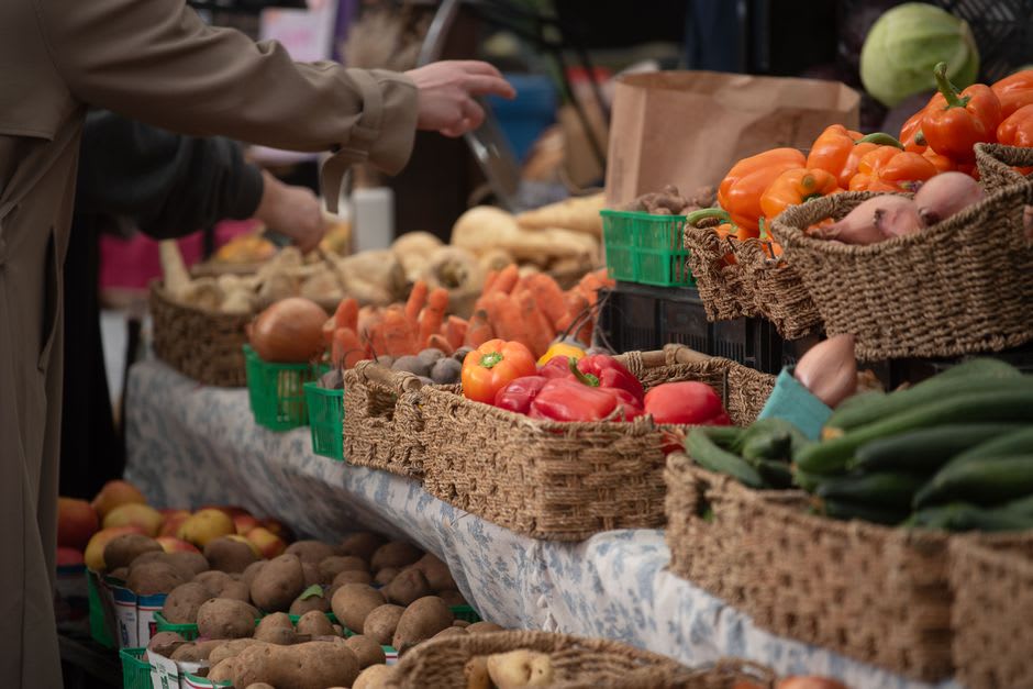 A vendor's table of Vermont cheeses and maple products at the Rutland Farmers Market