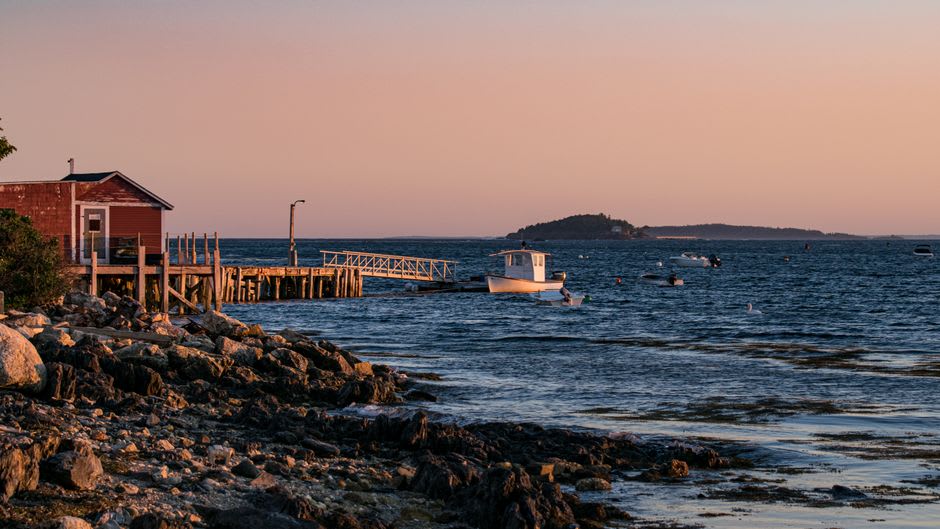 Lobster boats working the water off the rocky coast near Ragged Neck in Rye, New Hampshire