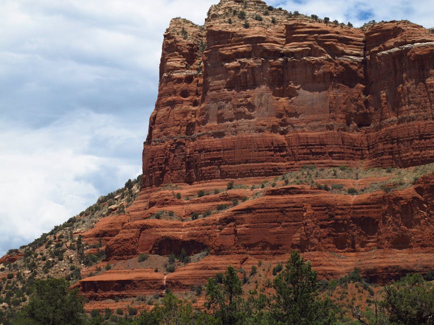 Cathedral Rock and red rock formations glowing at golden hour in Sedona