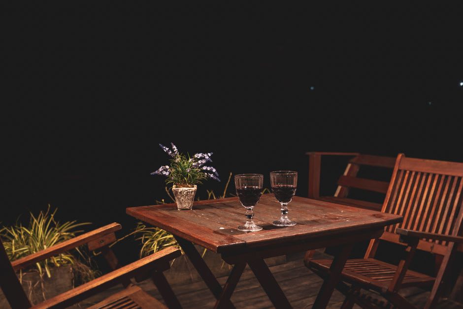 A glass of local wine on a patio overlooking Lake Champlain near Shelburne, Vermont