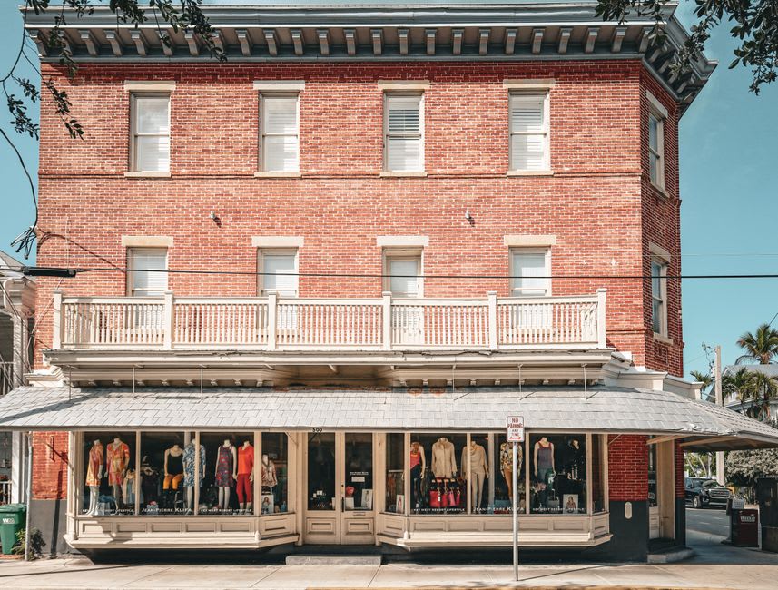 Historic brick storefronts and antique shops along Main Street in Van Buren, Arkansas