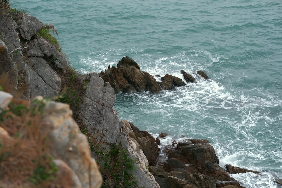 The granite Watch Hill Lighthouse overlooking the water at the tip of Rhode Island