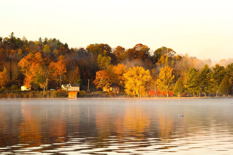 The Harriman Reservoir near Wilmington, Vermont at sunrise with mist over the water