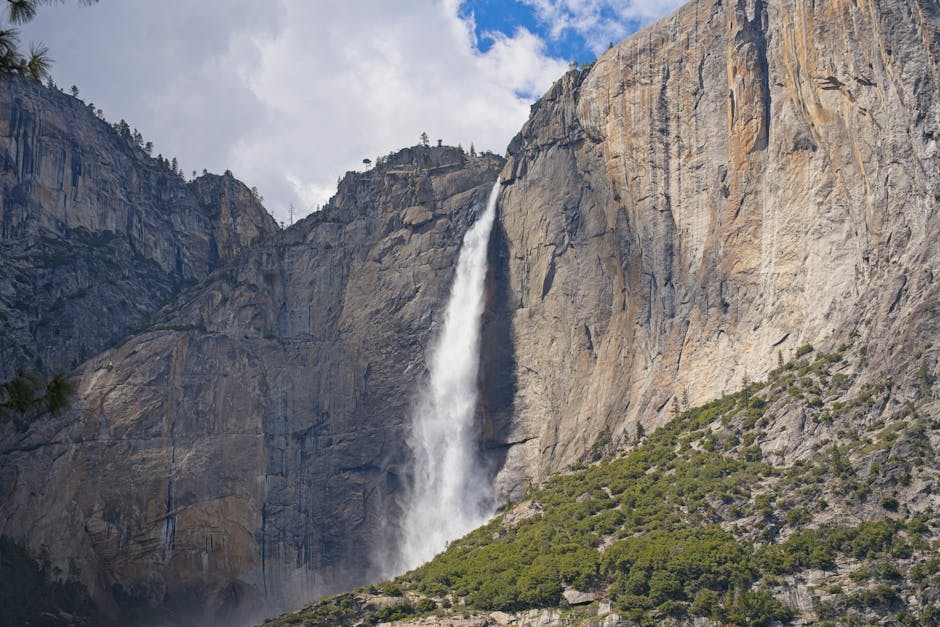 A thundering waterfall cascading over granite cliffs in Yosemite
