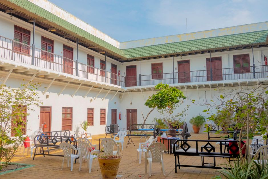 The wraparound veranda and ornate ironwork facade of the historic Queenscliff Hotel