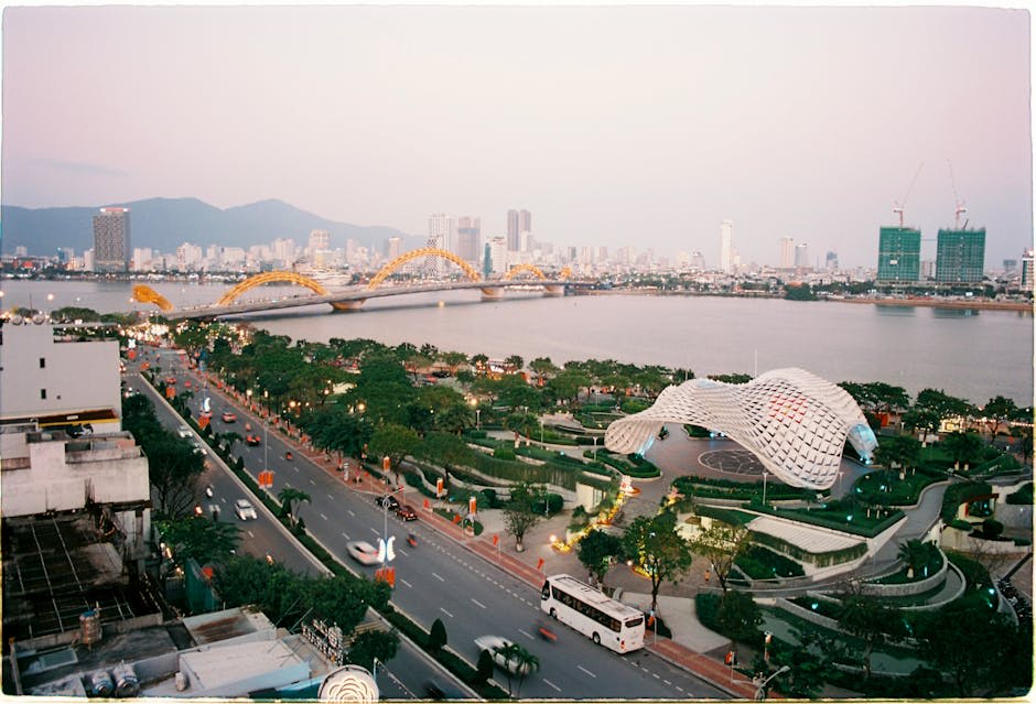 Scenic aerial view of Da Nang cityscape featuring the iconic Dragon Bridge and river