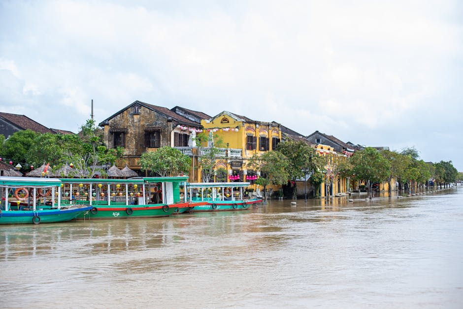 Serene riverside view of Hoi An's charming historical architecture and colorful boats