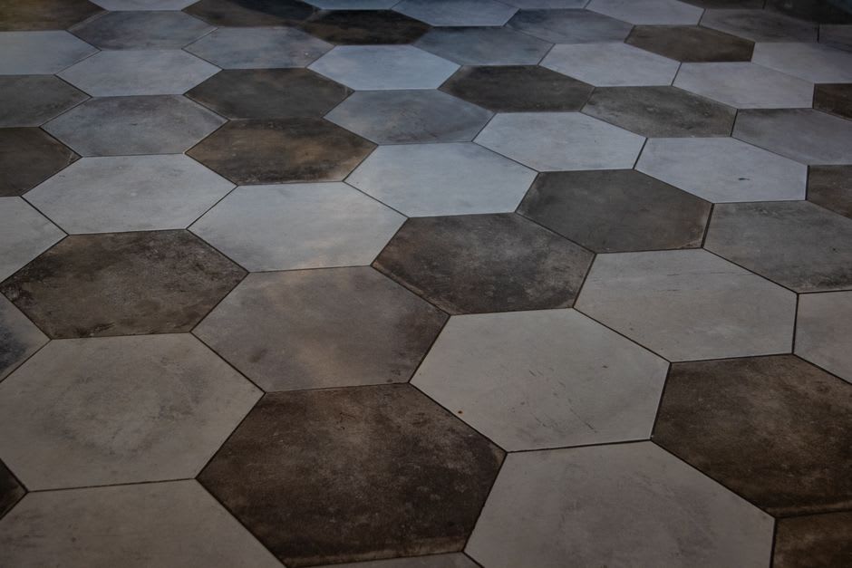 Weathered sandstone columns of the Temple of Allat rising from hexagonal paving stones