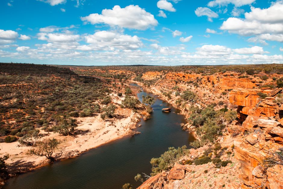Red limestone sea cliffs along the Kalbarri coastline with Indian Ocean waves breaking below