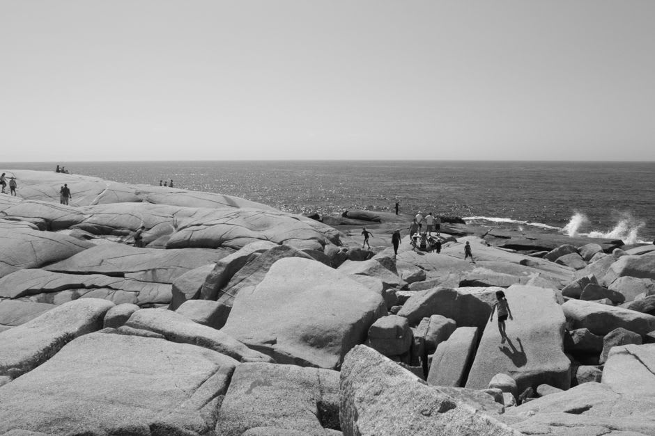 The curved granite face of Wave Rock with its distinctive wave-like overhang and color streaking