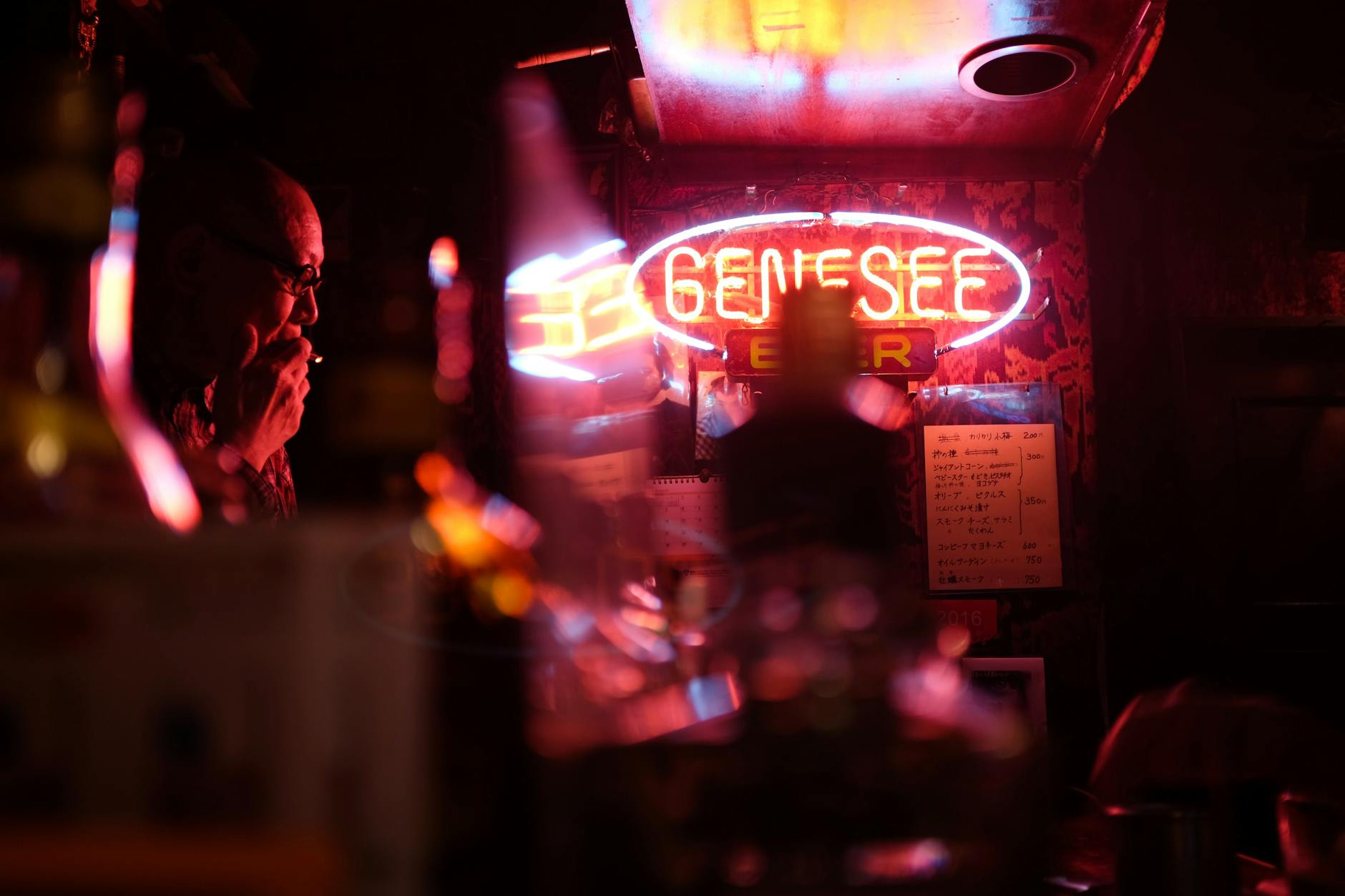 Narrow neon-lit alley of Golden Gai in Shinjuku with tiny bars