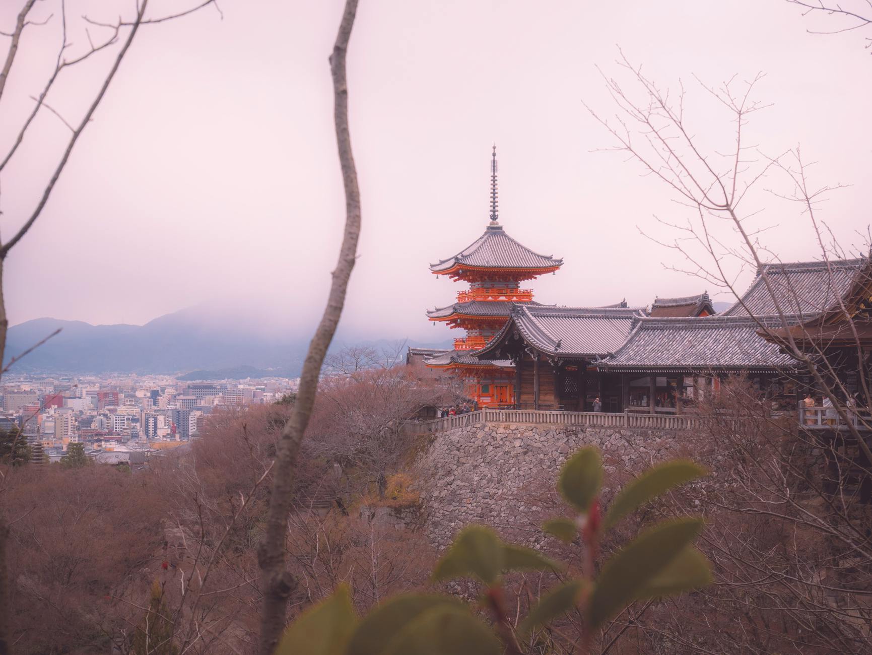 Kiyomizu-dera temple's wooden stage overlooking Kyoto with autumn foliage