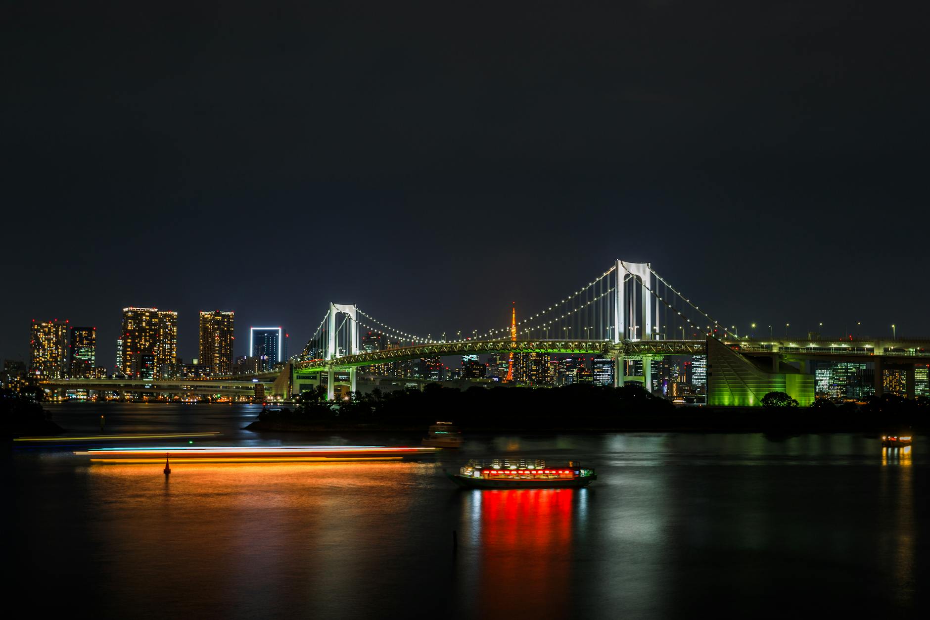 Odaiba waterfront with Tokyo Bay and city lights reflecting on the water