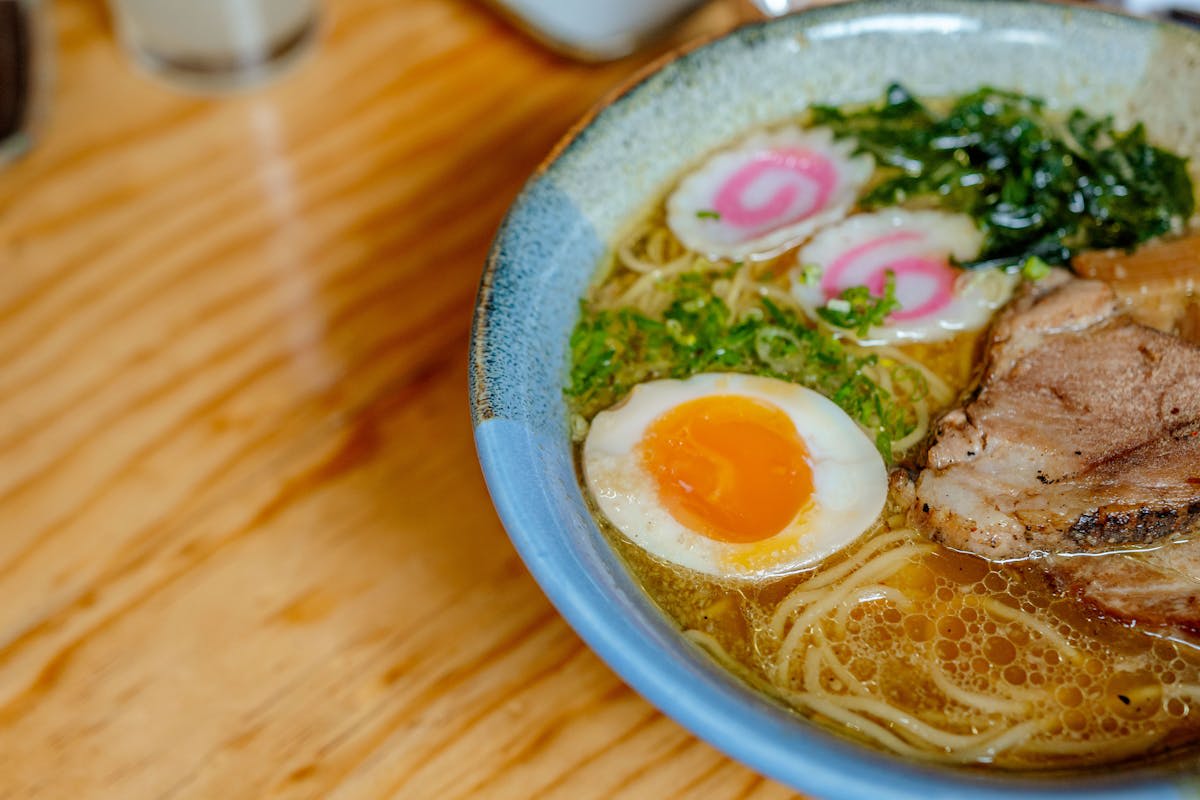 A perfect bowl of Japanese ramen with egg, noodles, and toppings