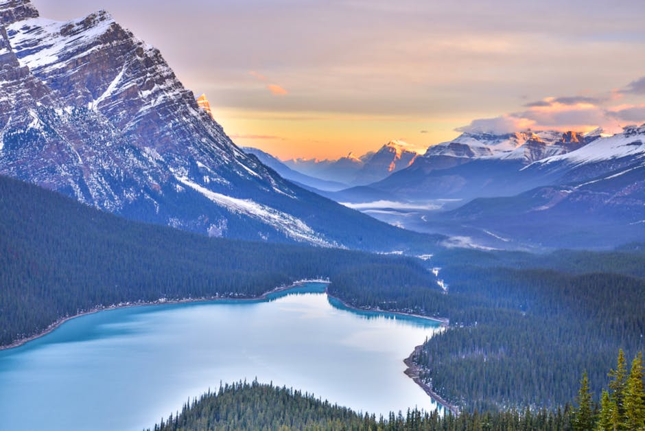 Turquoise glacial lake reflecting mountain peaks in the Canadian Rockies