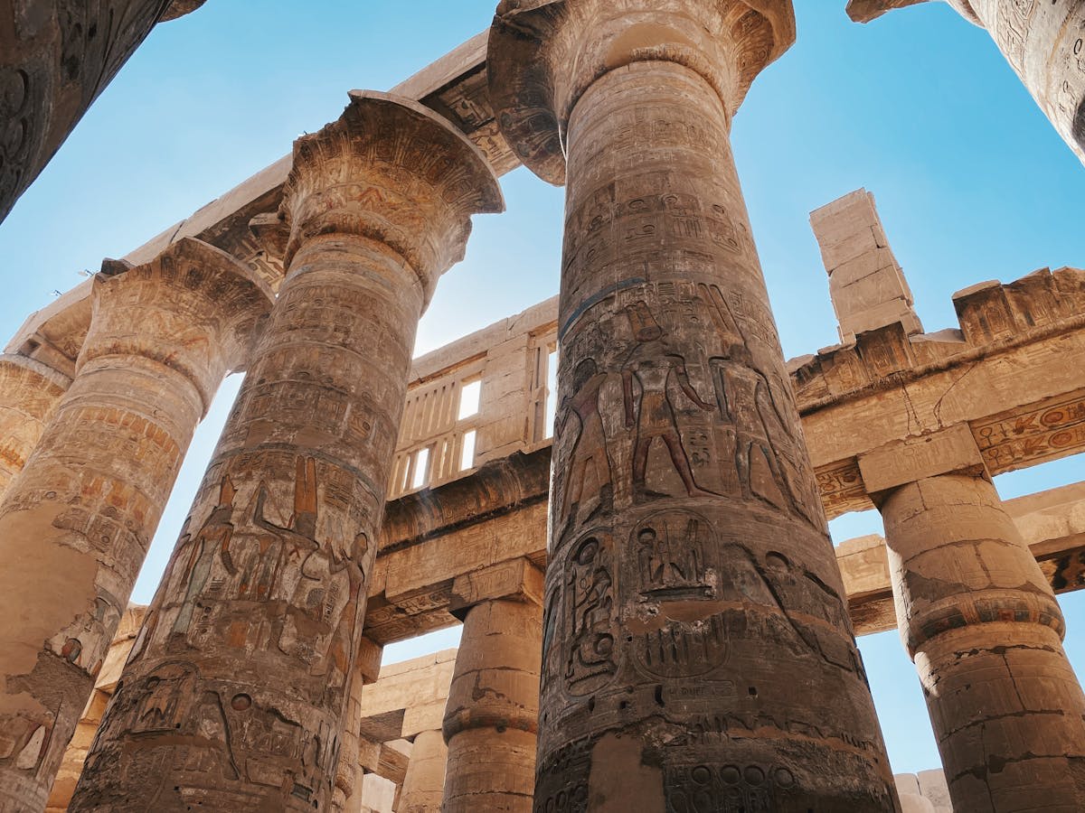 Ancient columns of Karnak Temple in warm morning light