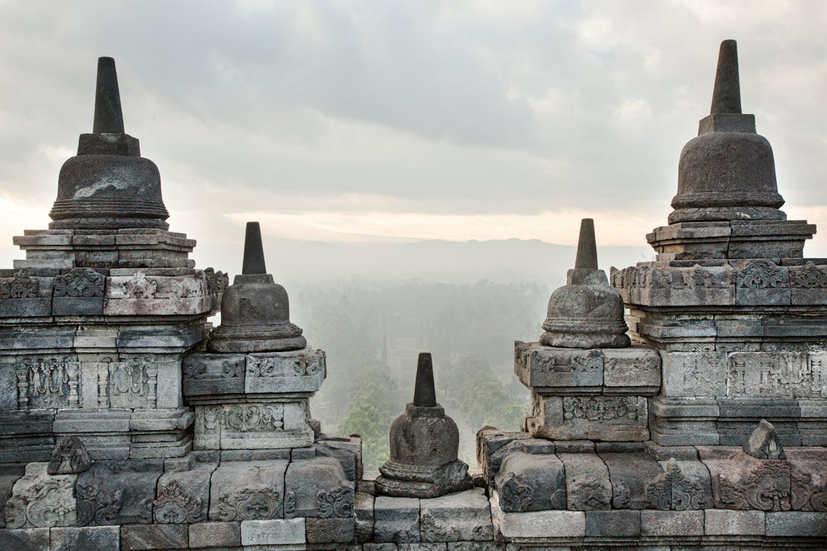 Borobudur temple emerging from morning mist at sunrise