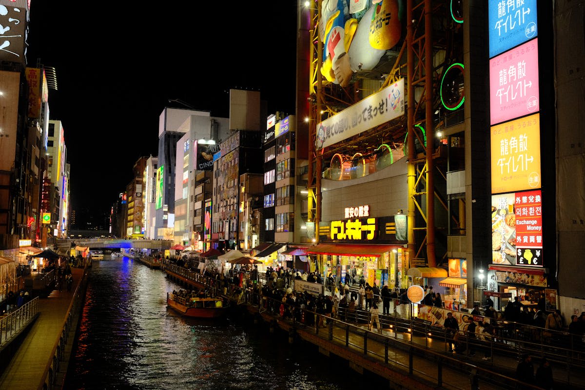 Neon reflections on the Dotonbori canal in Osaka at night