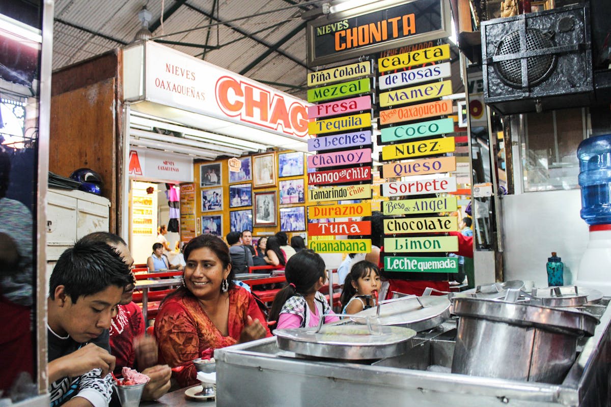 Bustling stalls and street food vendors at an Oaxacan market