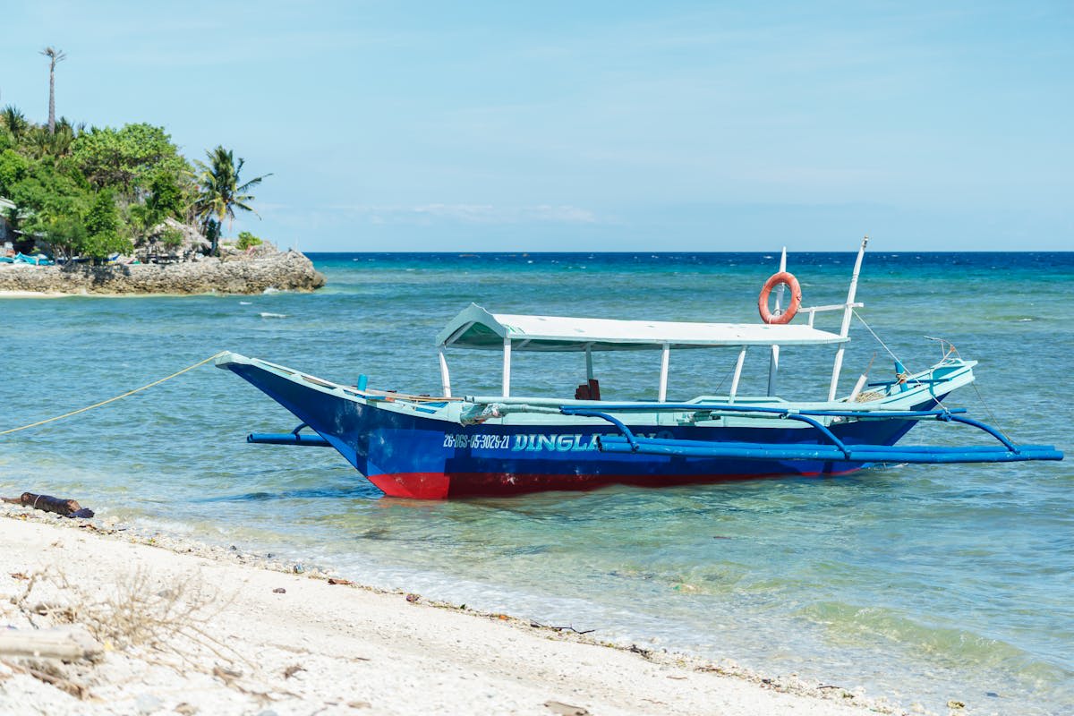 A traditional Filipino boat on crystal-clear tropical water