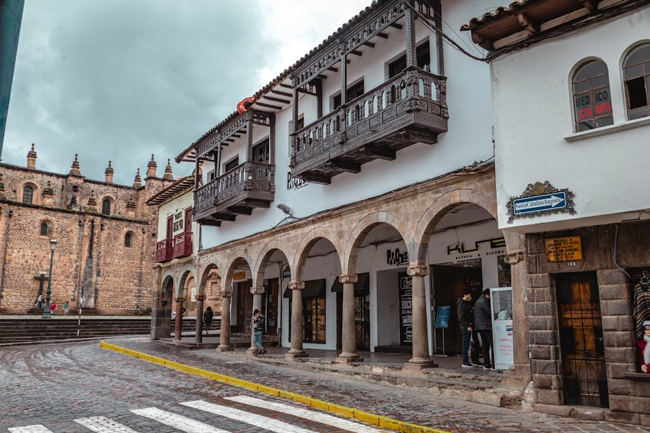 Cusco's colonial streets and Inca stone walls in warm afternoon light