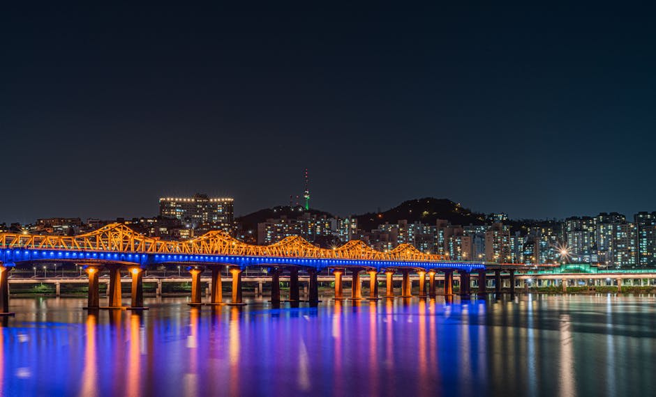 Seoul Tower glowing against the city skyline at night