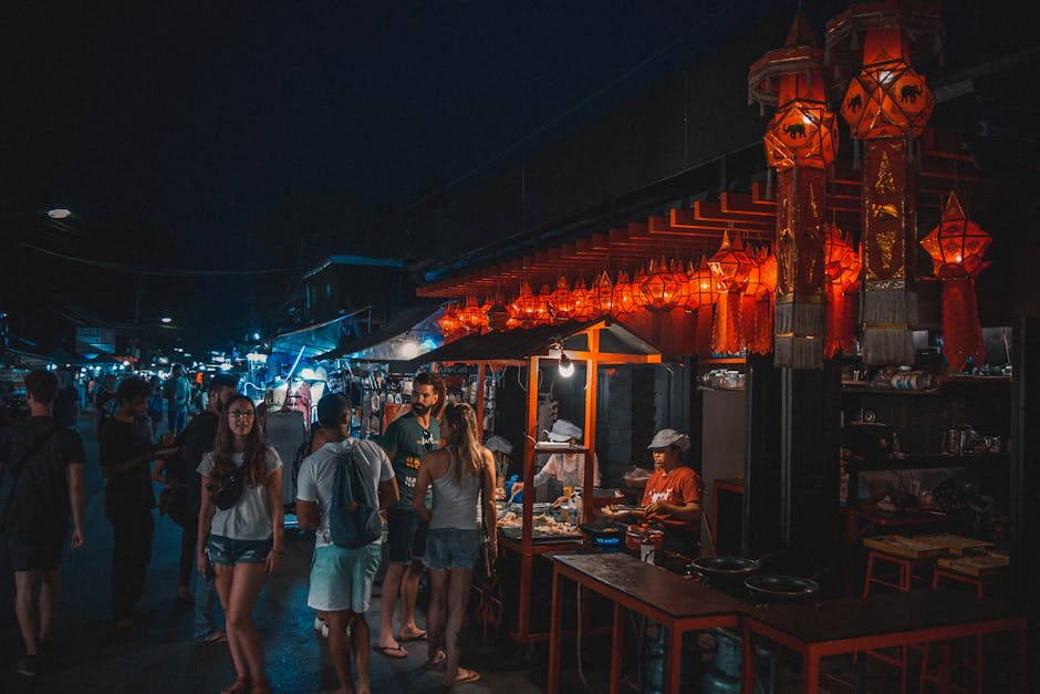 Lanterns and street food stalls lighting up a Chiang Mai night market