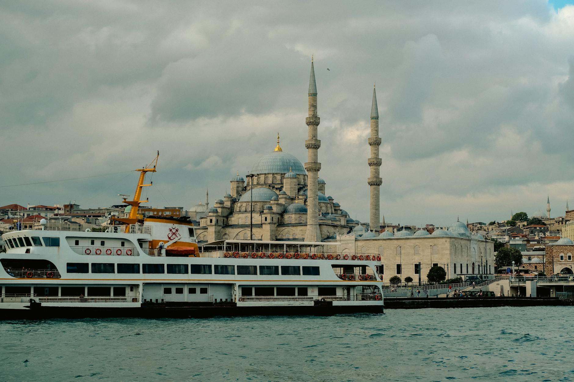 The Bosphorus at golden hour with ferries and mosques on the skyline