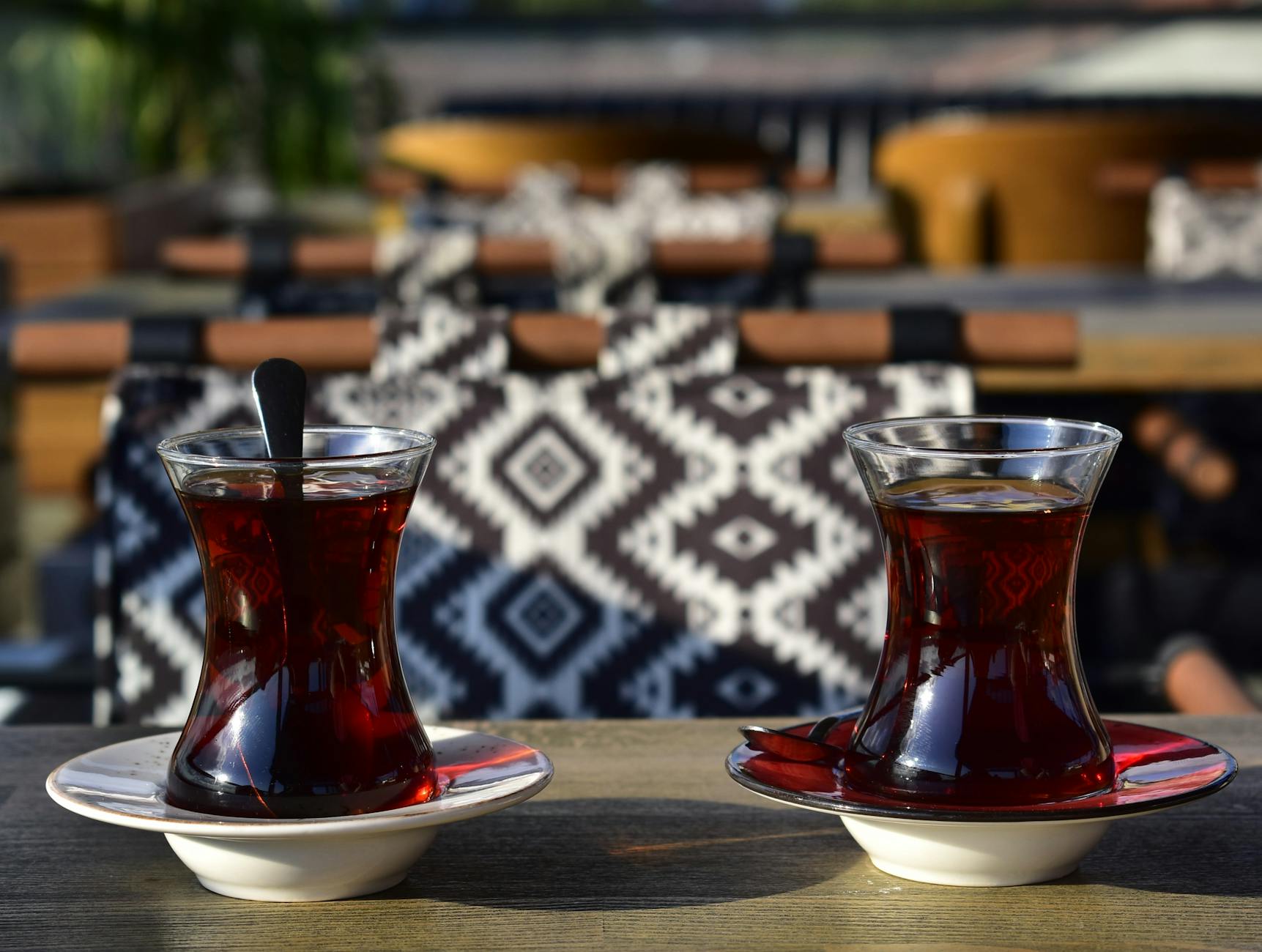 Tulip-shaped glasses of Turkish tea served on a traditional tray