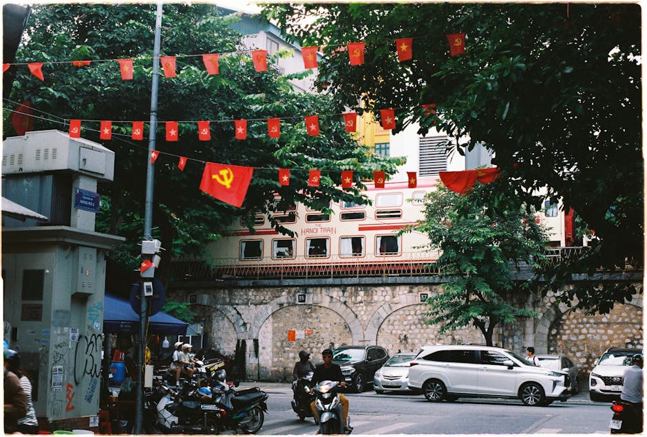 The Old Quarter of Hanoi with vibrant street life and red flags