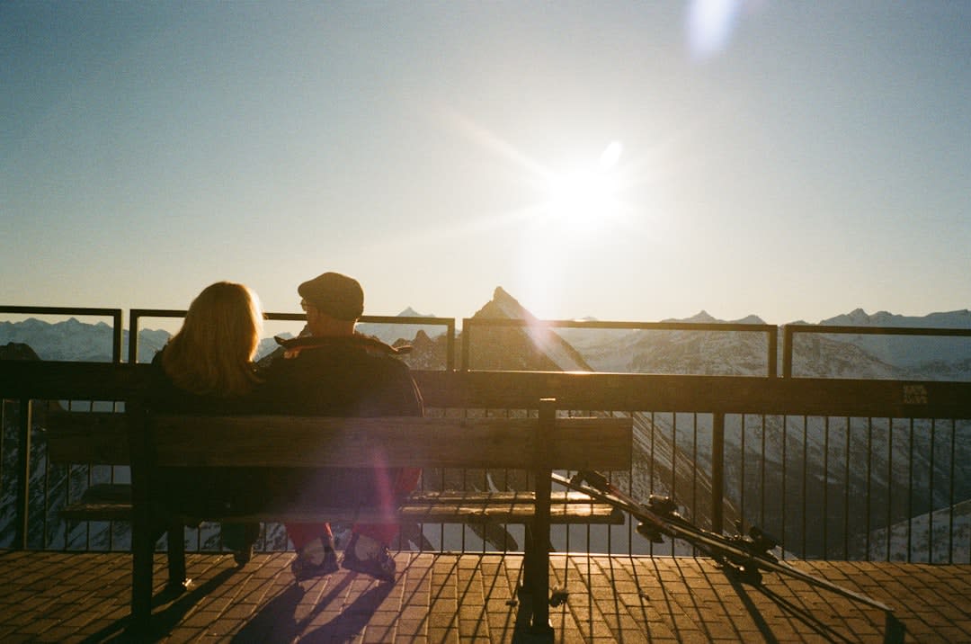 A crowded apres-ski bar terrace in Soldeu at sunset with skiers still in boots